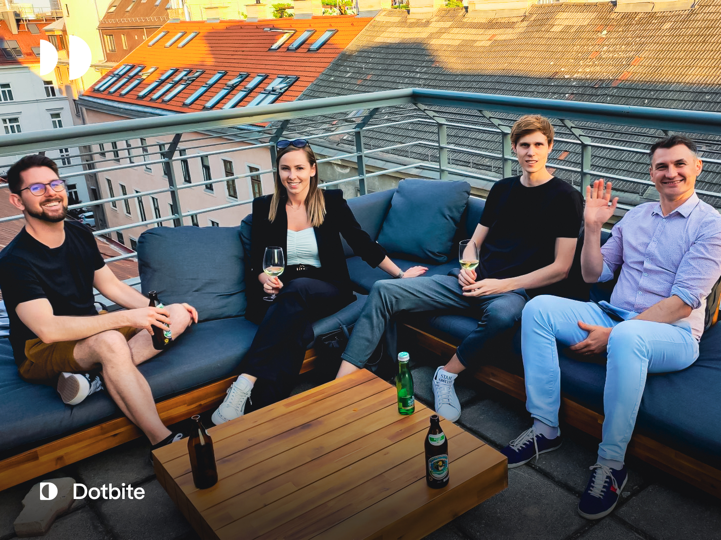 Dotbite team members enjoying some drinks on the sunny office terrace Dotbite team members enjoying some drinks on the sunny office terrace