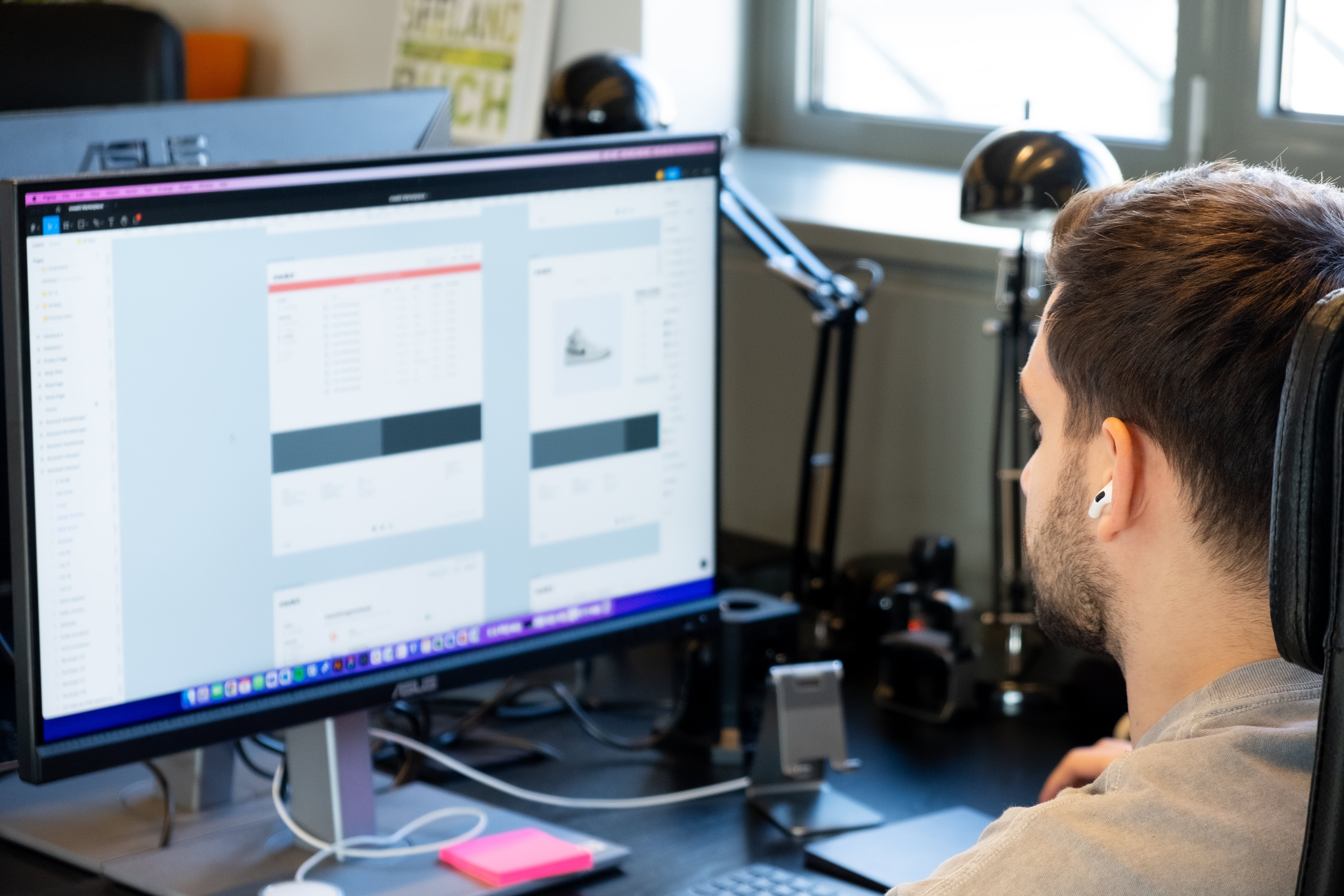 Co-founder and CEO Emir looking at a web app design Co-founder and CEO Emir looking at a web app design