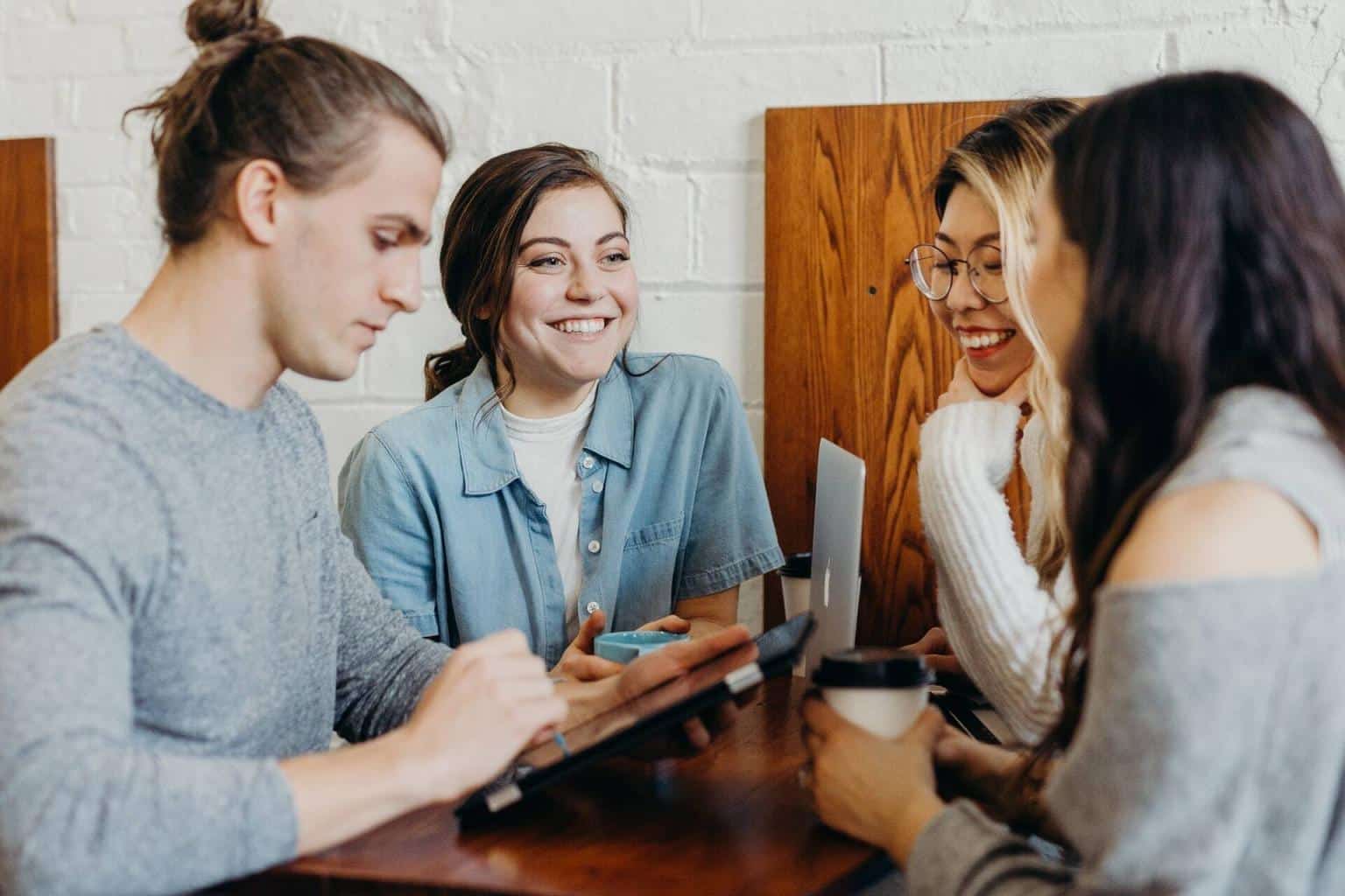 Team drinks coffee and laughs
