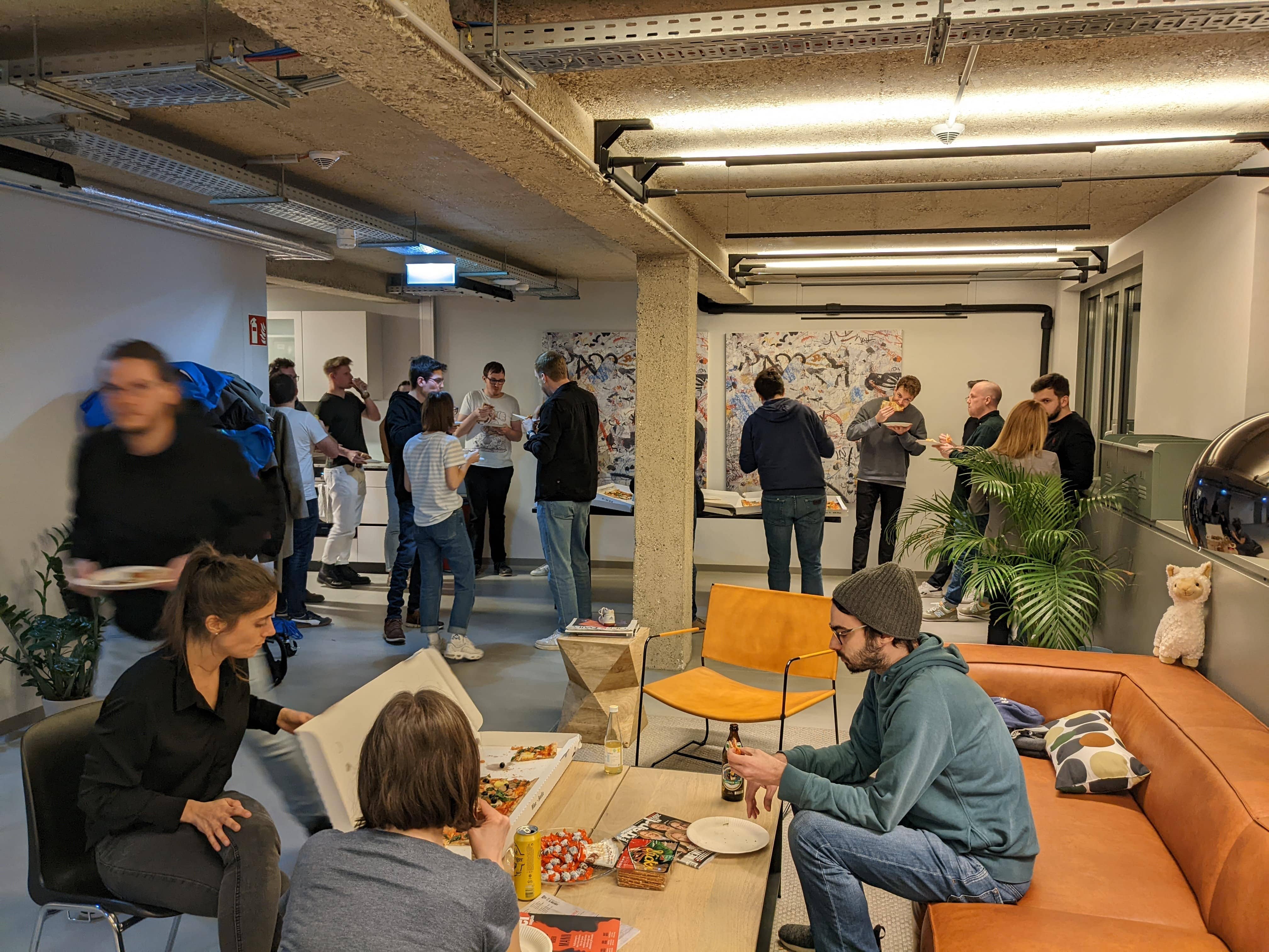 Event Audience enjoying pizza in our office after the event Event Audience enjoying pizza in our office after the event